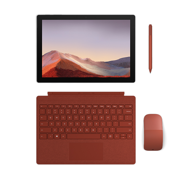 Surface Pro 7 on seuraavan sukupolven kannettava Surface Pro 7, joka on levitettynä auki, ja jonka vieressä on punainen näppäimistö, hiiri ja kynä