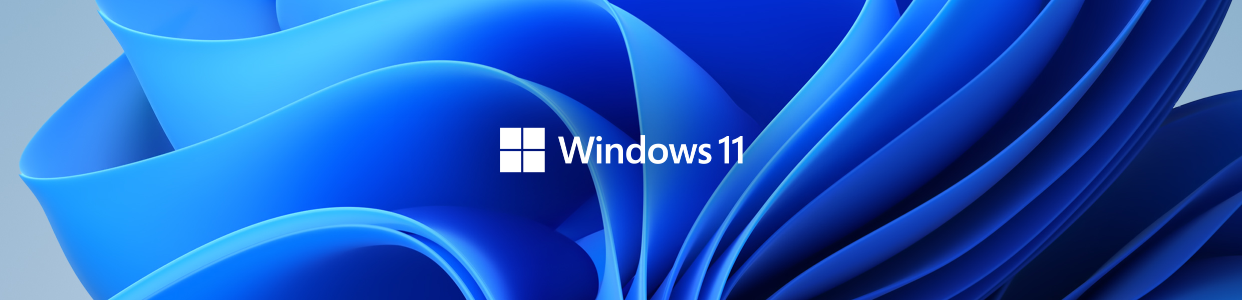 Windows 11 Windows 11-teksti valkoisin kirjaimin sinisen sävyisellä taustalla