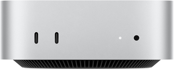 Mac mini edestä, kaksi Thunderbolt-porttia, merkkivalo ja kuulokeliitäntä, alhaalla viisto musta jalusta, tasainen yläosa, pyöristetyt sivut, suorat reunat, hopeanvärinen