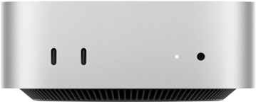 Mac mini edestä, hopeanvärinen runko, kaksi USB-C-porttia, virtapainike, merkkivalo, alareunassa jäähdytysritilä