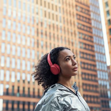 Korviin kiinnitettävät Bluetooth-kuulokkeet, punainen