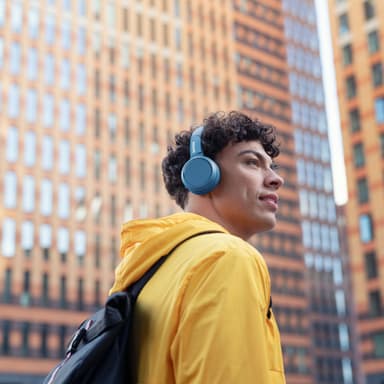 Korvassa olevat Bluetooth-kuulokkeet Siniset