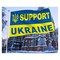 Ukrainan lippu kansallisen vaakunalla ja tekstillä "Support Ukraine" 94x60 cm polyesteri