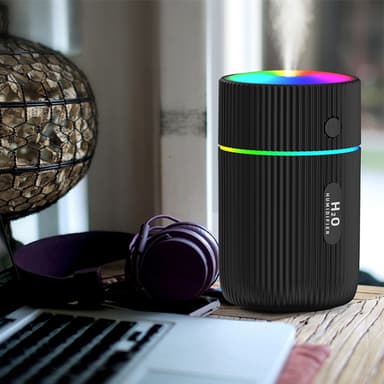 Kostutin värikkäällä LED-lampulla musta