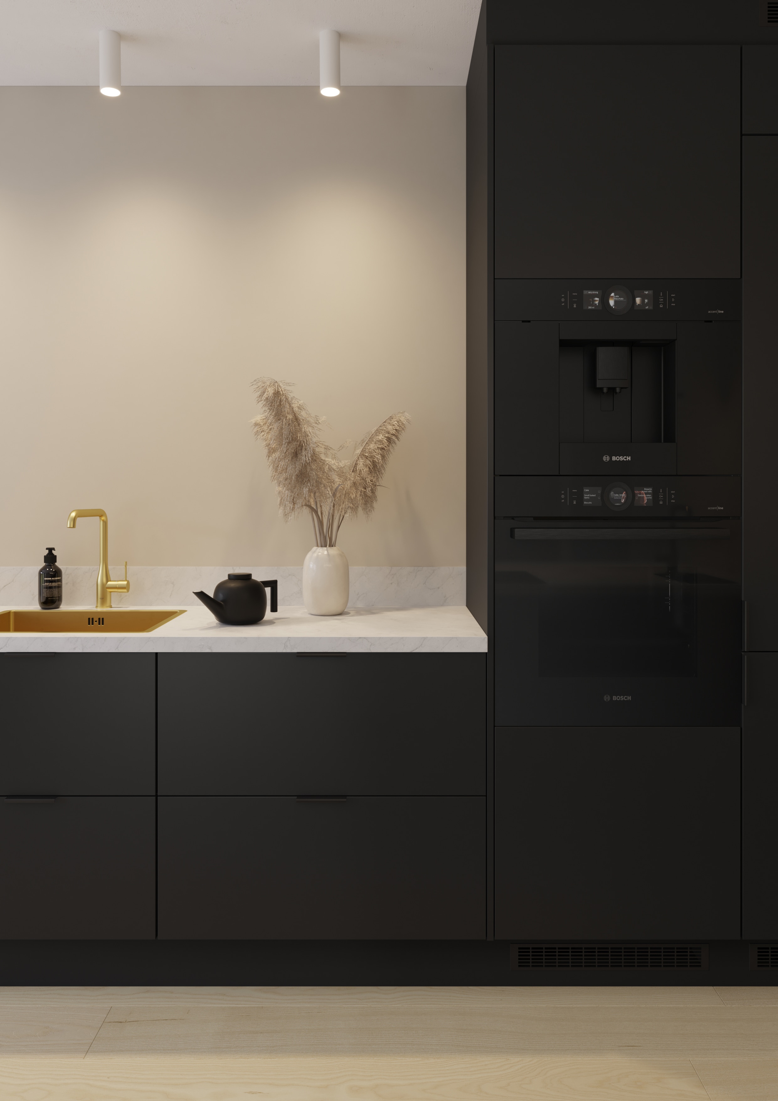 Kuva mustasta Epoq-keittiöstä kultaisella hanalla ja mustalla kahviautomaatilla
