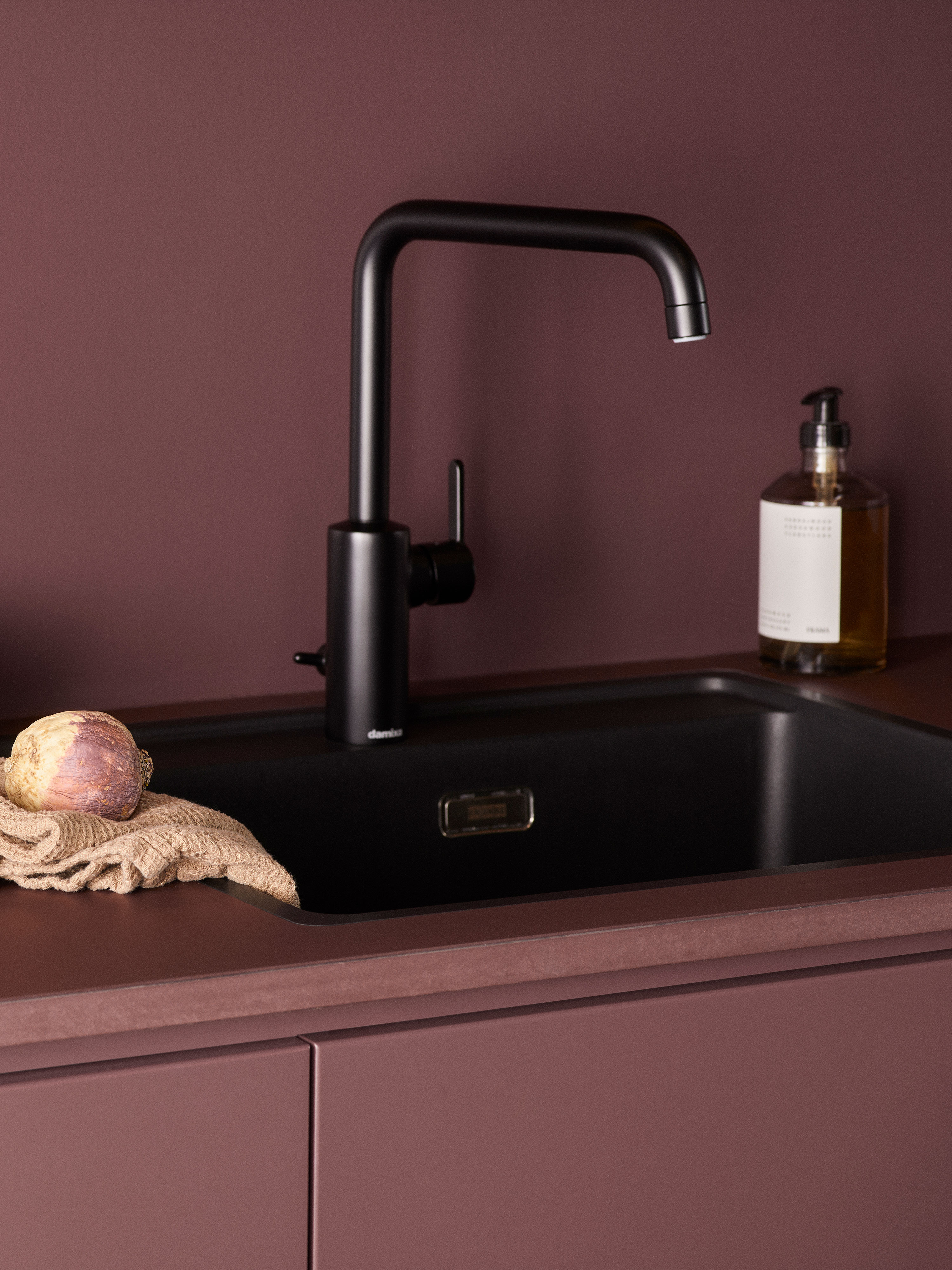 Black sink in an Epoq Trend Burgundy kitchen