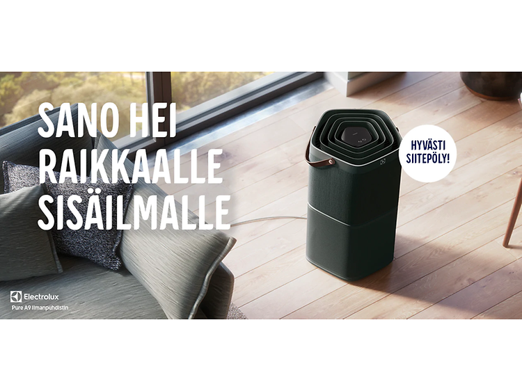 Ilmanpuhdistin olohuoneessa sohvan vieressä lattialla