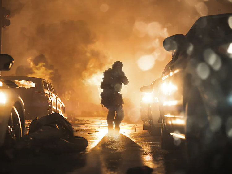 Call of Duty - kuvakaappaus pelistä - mies keskellä tietä autojen ympäröimänä