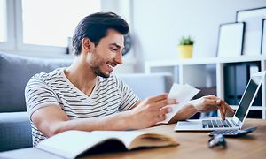 Man paying bills on computer
