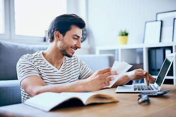 Man paying bills on computer