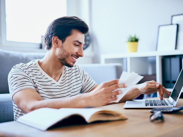 Man paying bills on computer