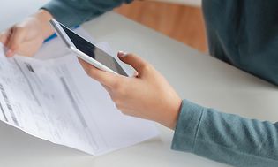 Woman paying bills