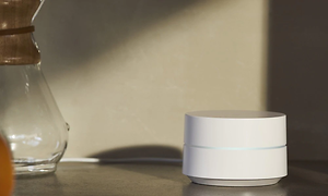 White Google WiFi on a counter