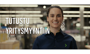 Gigantin työntekijä hymyilee kohti kameraa myymälässä ja teksti tutustu yritysmyyntiin