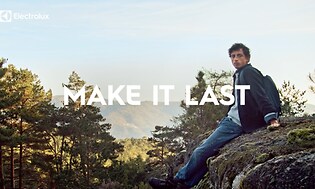 Mies ulkoilee vuorilla ja kampanjateksti 'Make it last'