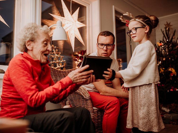 Christmas-Grandmother opening gift