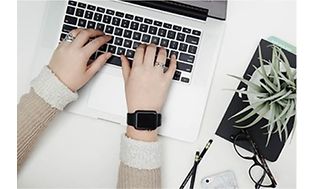 Computing - home office - woman at computer - 589x397