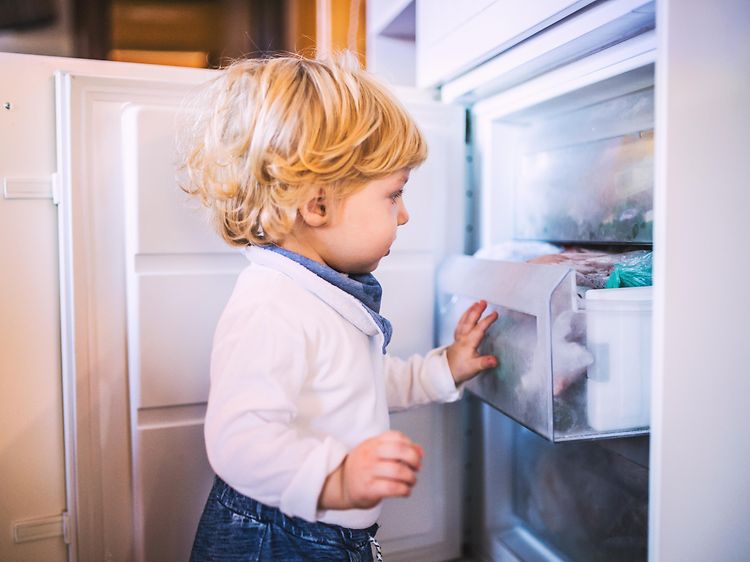 MDA-Freezers-Little boy opening a freezer