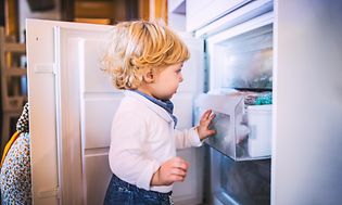 MDA-Freezers-Little boy opening  a freezer