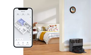 Älypuhelin ja Roborock Max V Ultra telakoituina taustalla
