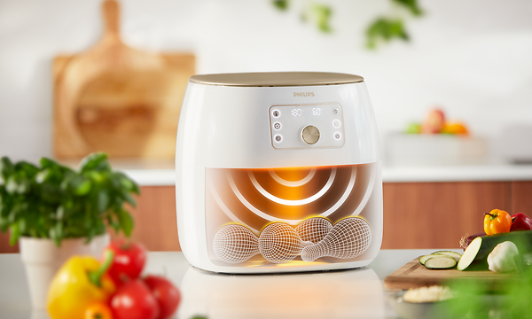 Valkoinen Philips Airfryer XXL ja kuvituskuva sen tekniikasta
