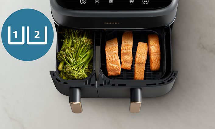 Philips Airfryer NA352 Dual Basket -kiertoilmakeitin, jonka toisessa laatikossa on parsakaalia ja toisessa lohta