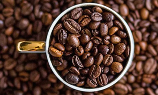 Coffee beans in a coffee cup