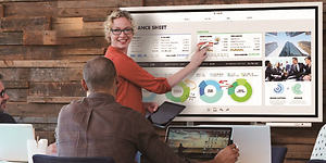 Woman presenting on Samsung Flip flipboard in meeting