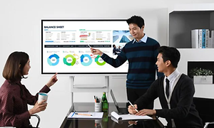 Three people in meeting room using Samsung Flip flipboard